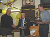  Chas Riegert, receives the Halco lures from Ken Matthews while John Jardine holds the Ken Matthews trophy.